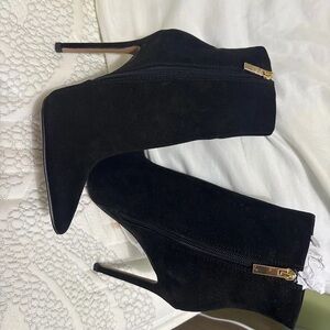 Elegant Black Heeled Boots with Gold Accents